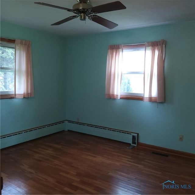 15979 Hill Rd, Defiance, OH 43512 - unfurnished room featuring wood finished floors, a ceiling fan, and baseboards