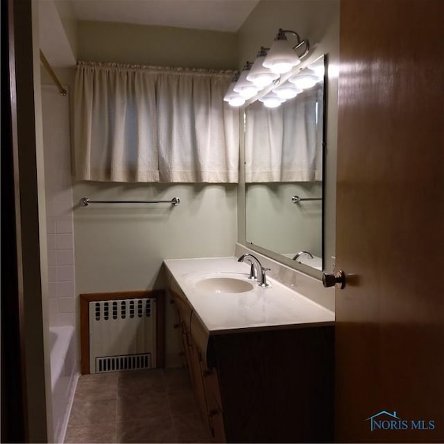 15979 Hill Rd, Defiance, OH 43512 - bathroom with radiator, vanity, and tile patterned floors