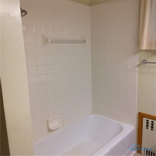 15979 Hill Rd, Defiance, OH 43512 - bathroom featuring radiator and washtub / shower combination