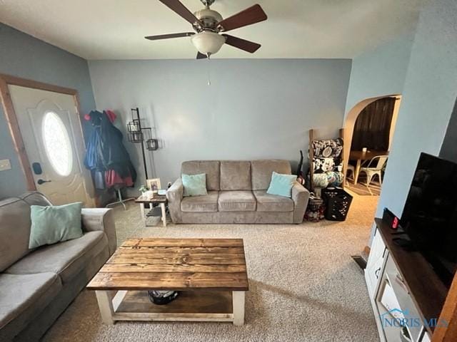663 W Summit St, Fostoria, OH 44830 - carpeted living area featuring arched walkways and ceiling fan