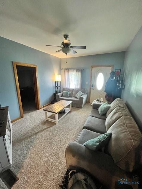 663 W Summit St, Fostoria, OH 44830 - carpeted living area featuring ceiling fan and baseboards