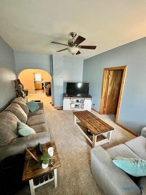 663 W Summit St, Fostoria, OH 44830 - carpeted living room with ceiling fan, baseboards, and arched walkways