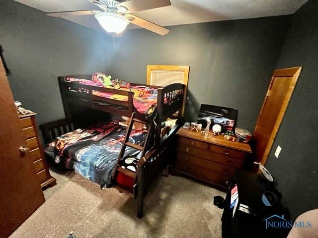 663 W Summit St, Fostoria, OH 44830 - carpeted bedroom with a ceiling fan