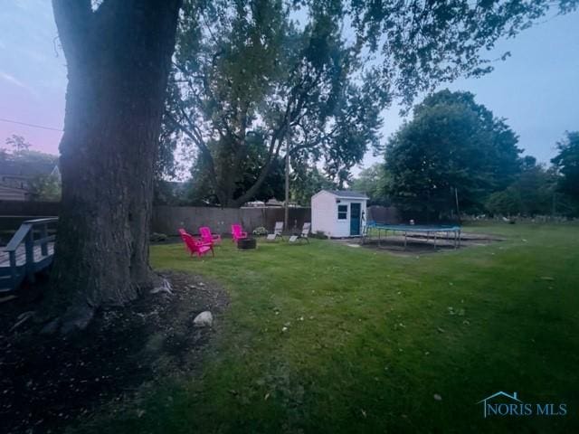 663 W Summit St, Fostoria, OH 44830 - view of yard featuring a trampoline