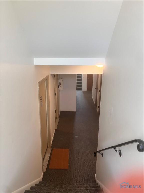 2134 Tedrow Rd, Toledo, OH 43614 - hallway featuring baseboards, stairway, and carpet floors