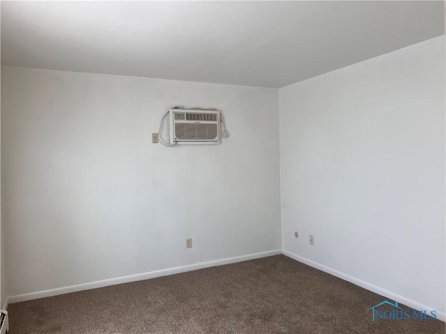 2134 Tedrow Rd, Toledo, OH 43614 - carpeted spare room with a wall unit AC, baseboards, and a baseboard radiator