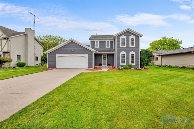 117 Freedom Ln, Waterville, OH 43566 - view of front of house with a garage, concrete driveway, and a front yard