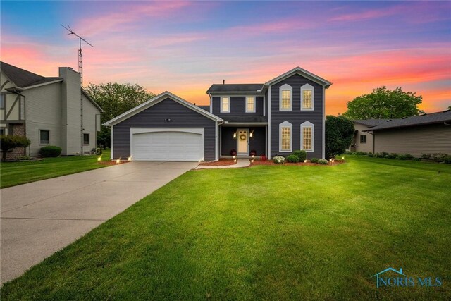 117 Freedom Ln, Waterville, OH 43566 - view of front of house featuring an attached garage, a lawn, and concrete driveway