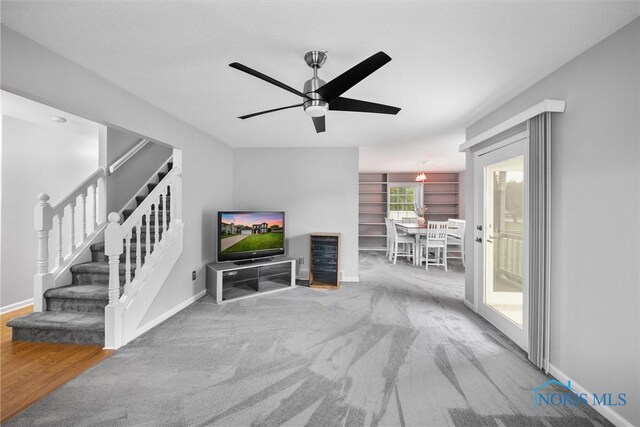 117 Freedom Ln, Waterville, OH 43566 - living room featuring stairway, a ceiling fan, and baseboards