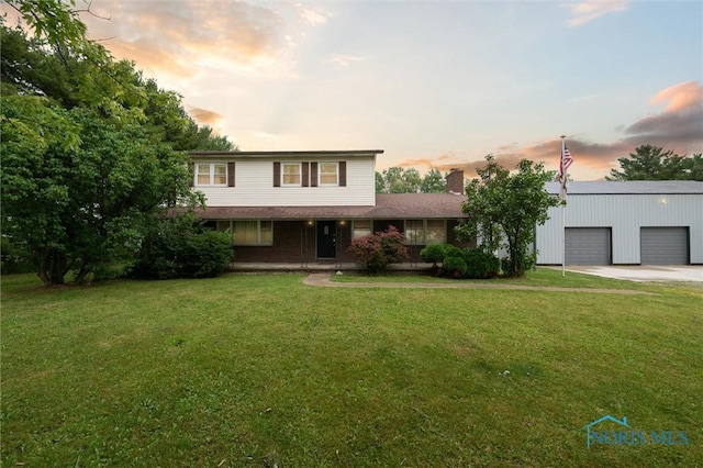 13914 Devils Hole Rd, Bowling Green, OH 43402 - traditional-style house with a porch, concrete driveway, a yard, and a chimney