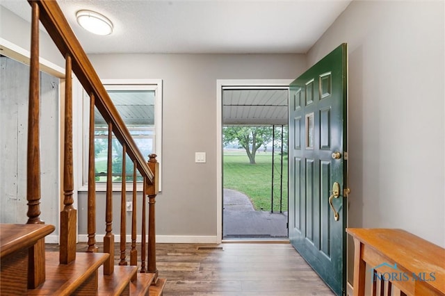 13914 Devils Hole Rd, Bowling Green, OH 43402 - entryway featuring wood finished floors, stairway, and baseboards