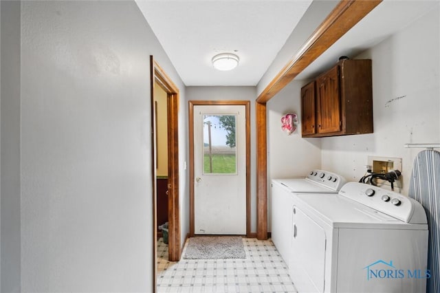 13914 Devils Hole Rd, Bowling Green, OH 43402 - washroom with cabinet space, separate washer and dryer, and light floors