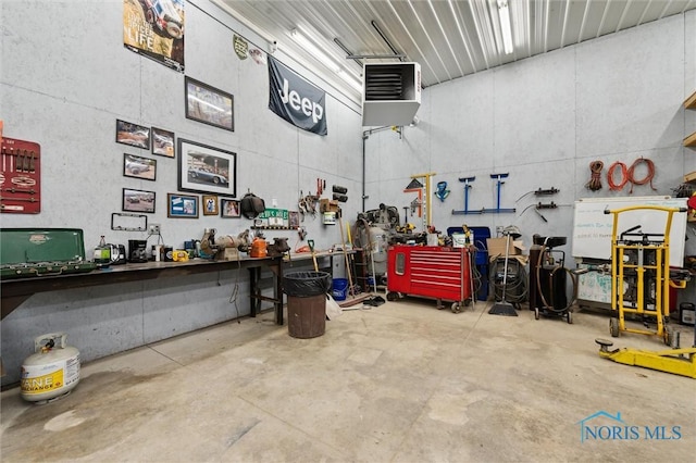 13914 Devils Hole Rd, Bowling Green, OH 43402 - garage featuring a workshop area and a heating unit