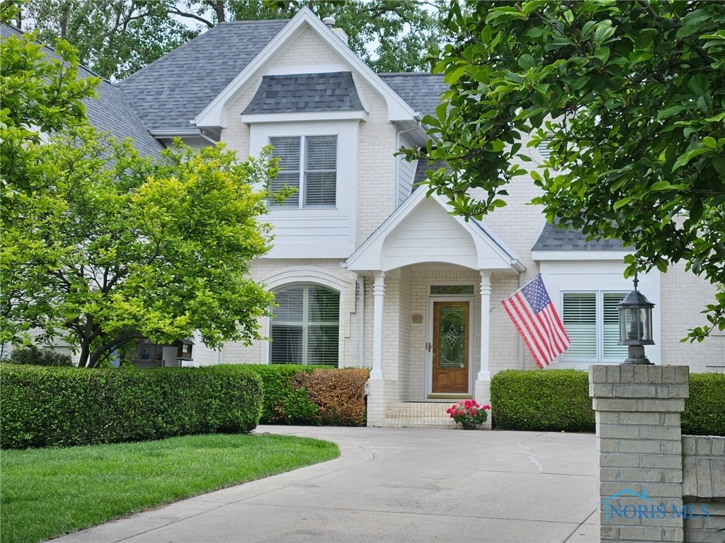 3236 Deep Water Ln, Maumee, OH 43537 - view of front facade with brick siding and a shingled roof