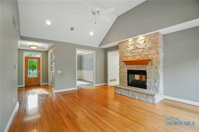 3236 Deep Water Ln, Maumee, OH 43537 - unfurnished living room featuring ceiling fan, wood-type flooring, a fireplace, and high vaulted ceiling