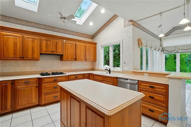 3236 Deep Water Ln, Maumee, OH 43537 - kitchen with vaulted ceiling, stainless steel dishwasher, a skylight, light countertops, and brown cabinetry