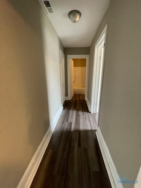 821 Vinton St, Toledo, OH 43609 - hall with dark wood-type flooring and baseboards