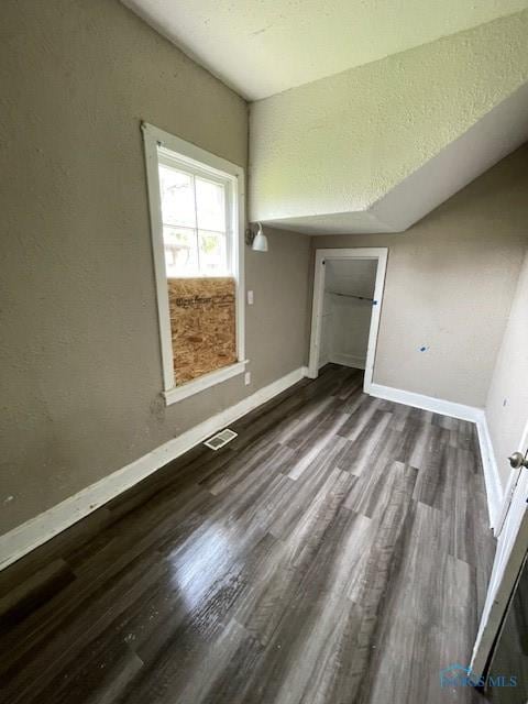 821 Vinton St, Toledo, OH 43609 - unfurnished bedroom featuring baseboards, wood finished floors, and a closet