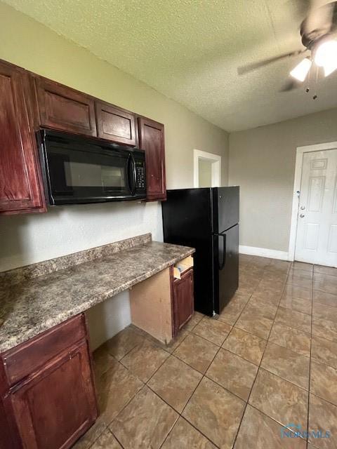 821 Vinton St, Toledo, OH 43609 - kitchen with black appliances, a textured ceiling, ceiling fan, dark countertops, and tile patterned floors