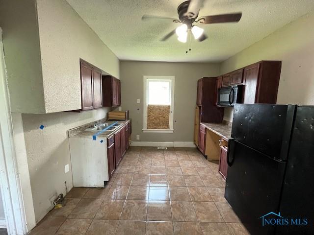 821 Vinton St, Toledo, OH 43609 - kitchen featuring black appliances, ceiling fan, a textured ceiling, a sink, and baseboards