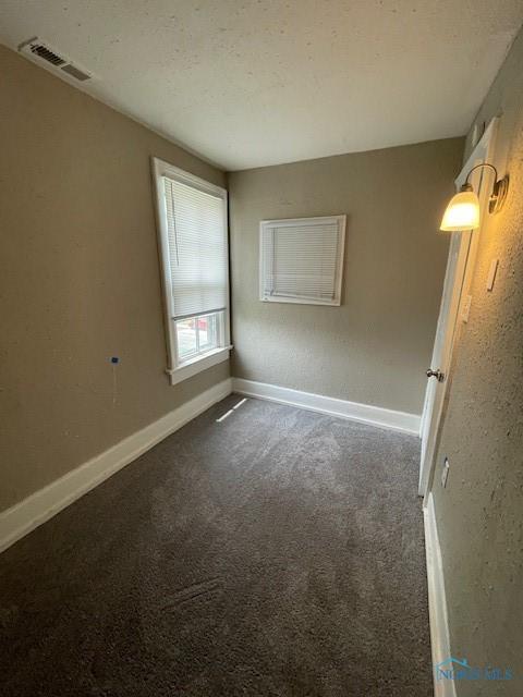 821 Vinton St, Toledo, OH 43609 - spare room with carpet flooring and baseboards