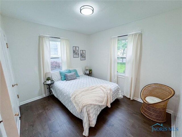 4635 Vermaas Ave, Toledo, OH 43612 - bedroom with dark wood-style flooring and baseboards