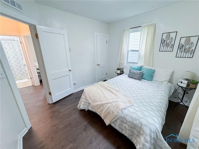 4635 Vermaas Ave, Toledo, OH 43612 - bedroom with dark wood-type flooring and baseboards
