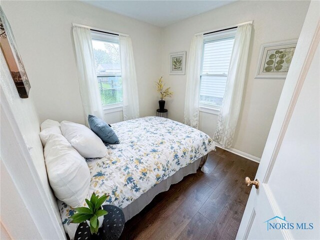 4635 Vermaas Ave, Toledo, OH 43612 - bedroom with dark wood finished floors and baseboards