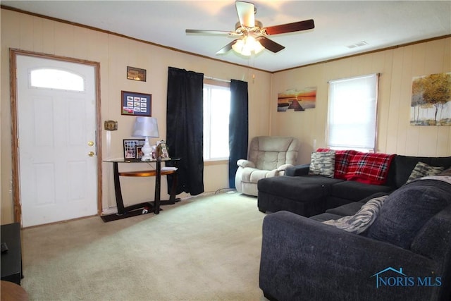 2544 110th St, Toledo, OH 43611 - carpeted living area with crown molding and ceiling fan