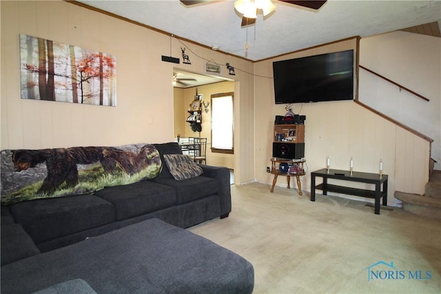 2544 110th St, Toledo, OH 43611 - carpeted living room with a ceiling fan and ornamental molding