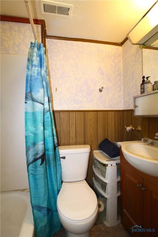 2544 110th St, Toledo, OH 43611 - bathroom featuring wainscoting, vanity, wallpapered walls, shower / bath combo, and toilet