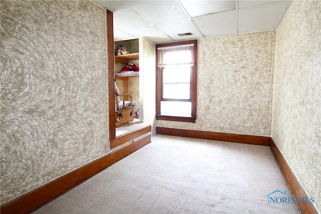 2544 110th St, Toledo, OH 43611 - spare room featuring carpet, wallpapered walls, a drop ceiling, and baseboards