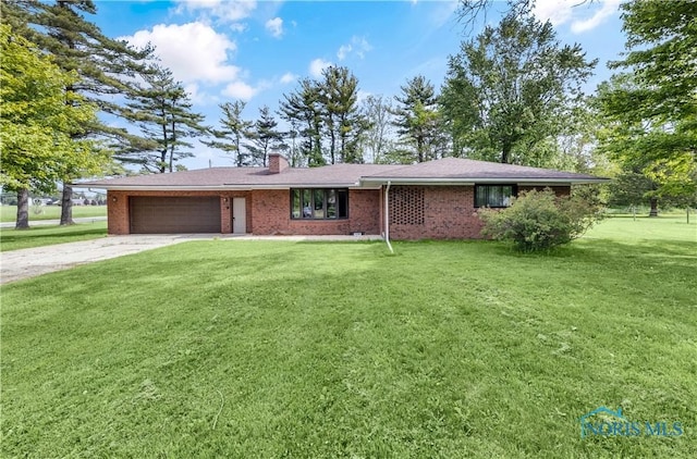3407 Waterville Swanton Rd, Swanton, OH 43558 - ranch-style home with an attached garage, driveway, a chimney, a front yard, and brick siding