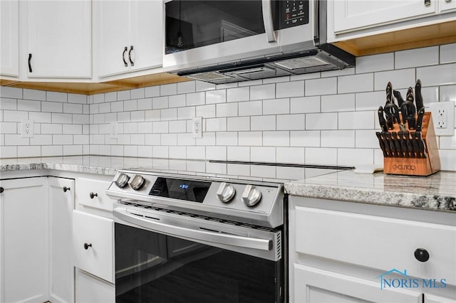 819 Wood Sorrel Ln, Perrysburg, OH 43551 - kitchen featuring appliances with stainless steel finishes, white cabinets, backsplash, and light stone countertops