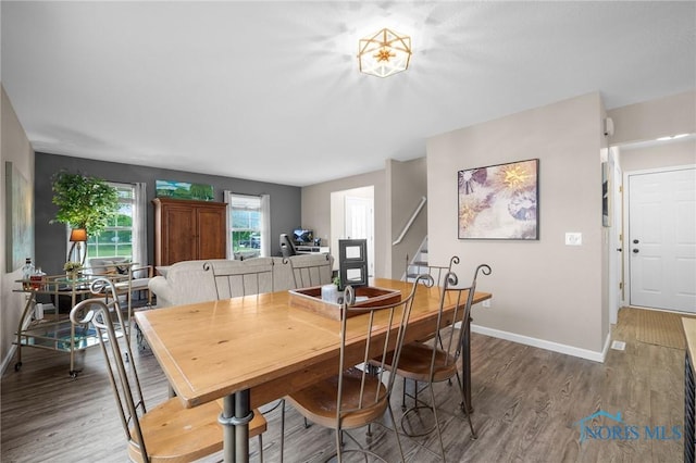 819 Wood Sorrel Ln, Perrysburg, OH 43551 - dining space with wood finished floors, baseboards, and stairway