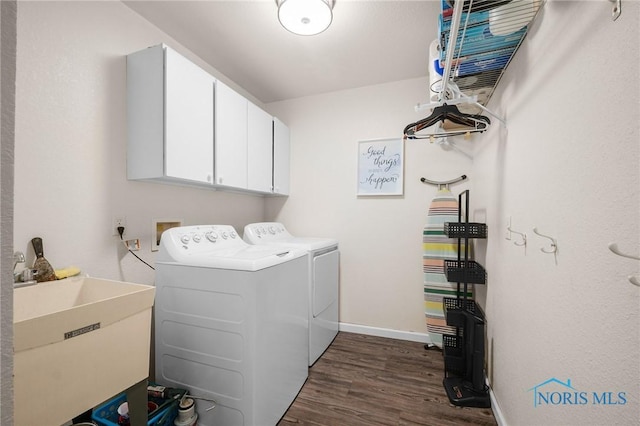 819 Wood Sorrel Ln, Perrysburg, OH 43551 - laundry area with cabinet space, washer and clothes dryer, dark wood-style floors, and baseboards