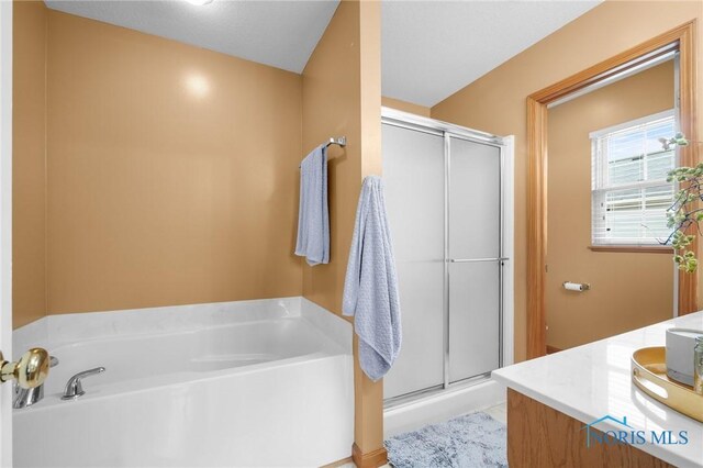 819 Wood Sorrel Ln, Perrysburg, OH 43551 - bathroom featuring vanity, a bath, and a shower stall