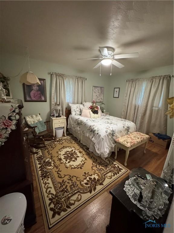 1505 W St, Evansport, OH 43519 - bedroom with wood finished floors and a ceiling fan
