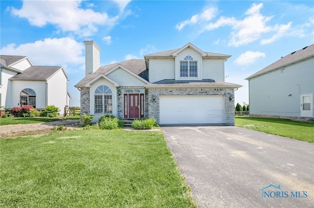 7195 Twin Lakes Rd, Perrysburg, OH 43551 - traditional-style home featuring asphalt driveway, brick siding, an attached garage, a front lawn, and a chimney
