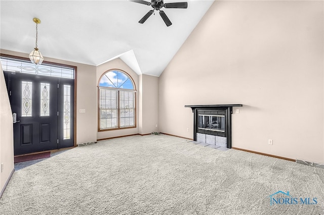 7195 Twin Lakes Rd, Perrysburg, OH 43551 - entrance foyer featuring carpet, a ceiling fan, baseboards, lofted ceiling, and a fireplace with flush hearth
