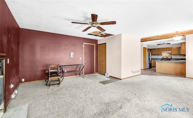 7195 Twin Lakes Rd, Perrysburg, OH 43551 - unfurnished living room with baseboards, a ceiling fan, and light colored carpet