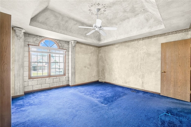 7195 Twin Lakes Rd, Perrysburg, OH 43551 - empty room with carpet, a textured ceiling, a raised ceiling, ceiling fan, and baseboards