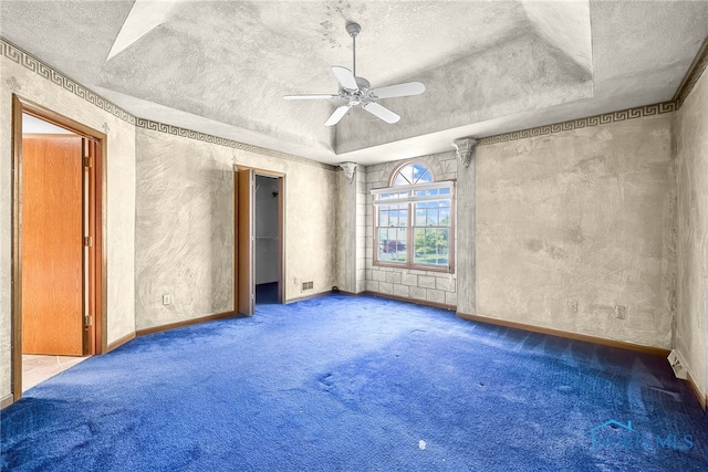 7195 Twin Lakes Rd, Perrysburg, OH 43551 - unfurnished room with a textured ceiling, carpet flooring, ceiling fan, and baseboards