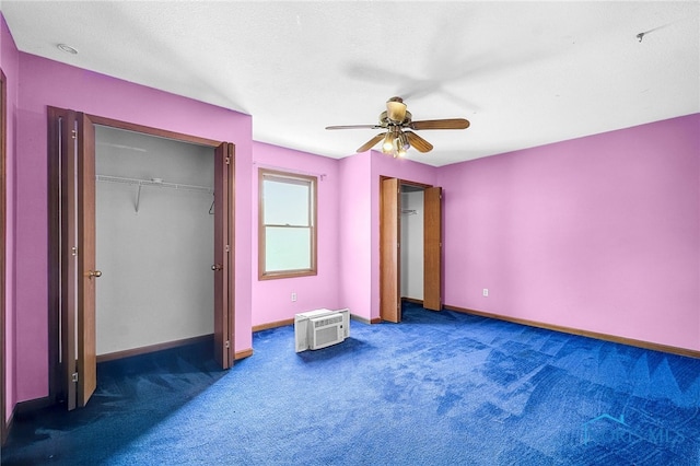7195 Twin Lakes Rd, Perrysburg, OH 43551 - unfurnished bedroom featuring carpet, baseboards, a wall unit AC, and a ceiling fan