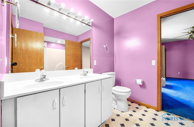 7195 Twin Lakes Rd, Perrysburg, OH 43551 - bathroom with double vanity, toilet, tile patterned floors, and ceiling fan