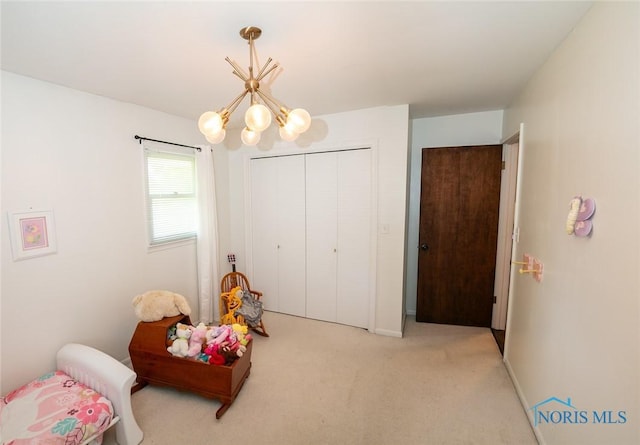 615 Hillcrest Ave, Findlay, OH 45840 - recreation room with a chandelier, light carpet, and baseboards