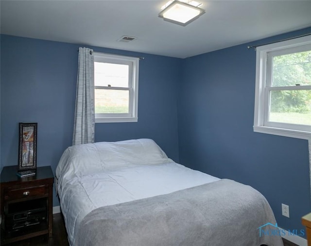 615 Hillcrest Ave, Findlay, OH 45840 - bedroom with multiple windows and baseboards