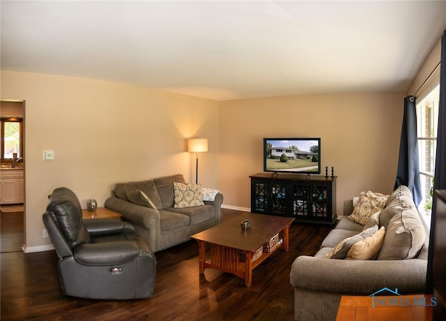 615 Hillcrest Ave, Findlay, OH 45840 - living area featuring healthy amount of natural light, dark wood-style floors, and baseboards