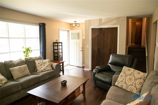615 Hillcrest Ave, Findlay, OH 45840 - living room featuring dark wood-style flooring, baseboards, and stairs