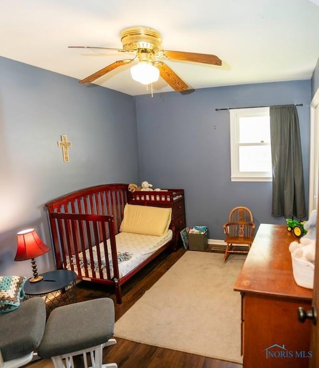 615 Hillcrest Ave, Findlay, OH 45840 - bedroom with wood finished floors, a ceiling fan, and baseboards